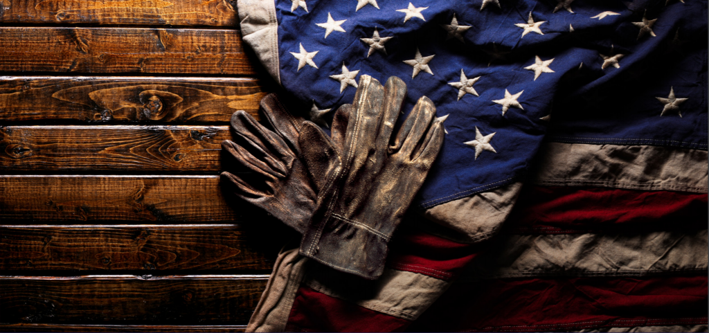 work gloves and an American flag on polished wood