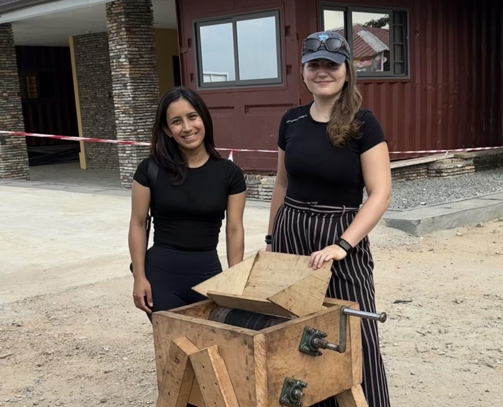 Jazmin Mucino and Estelle Martin with a briquette maker in Ghana August 2024