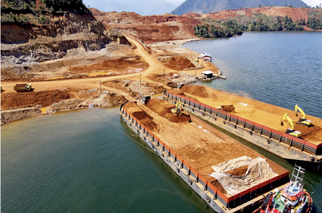 Pictured is nickel being mined and loaded onto barges in Sulawesi, Indonesia. iStock